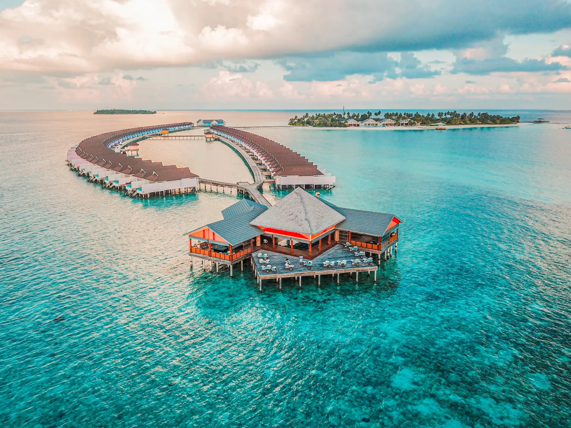 Overwater villas in a turquoise lagoon in the Maldives